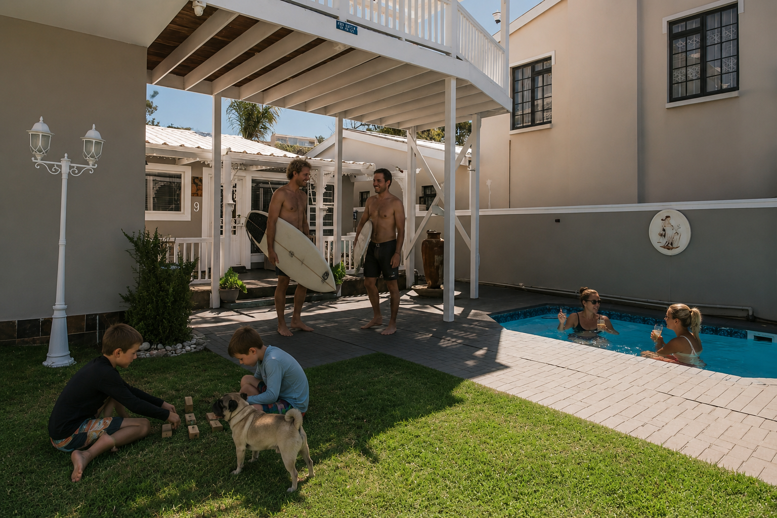 Family, friends, children and surfers together in the garden and pool area at Surf n Sea